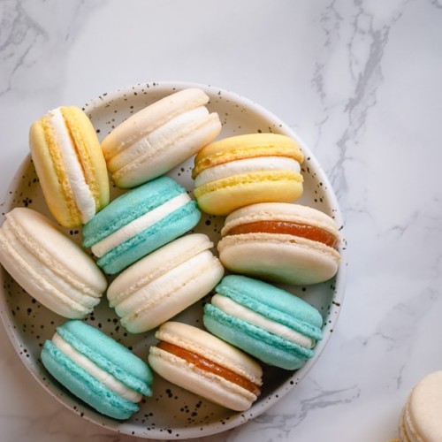 This basic macaron recipe is perfect for beginners. In this post, you'll find all my tips and tricks for perfectly full shells with pretty little feet and smooth tops, as well as my detailed video tutorial to walk you through the entire process! #frenchmacarons #macaronrecipe
