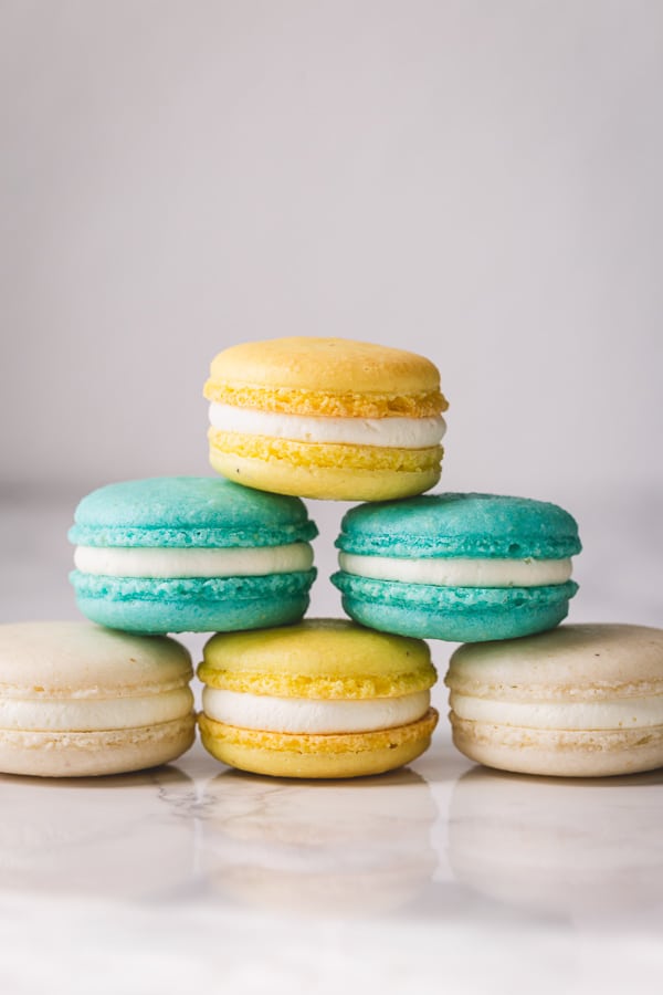 A comprehensive macaron recipe with lots of tips and tricks for perfectly full french macarons. So much helpful information here! #frenchmacarons #macaronrecipe