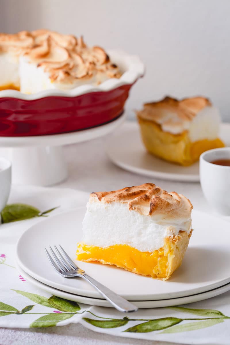 Classic lemon meringue pie recipe with lots of tips and tricks for a perfect pie every time! No more weeping and shrinking. This's the BEST! #lemonmeringuepie