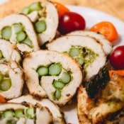 Stuffed chicken roll-ups with asparagus and cheese and smeared with fragrant pesto - an effortlessly impressive and satisfying main dish, or even an appetizer!