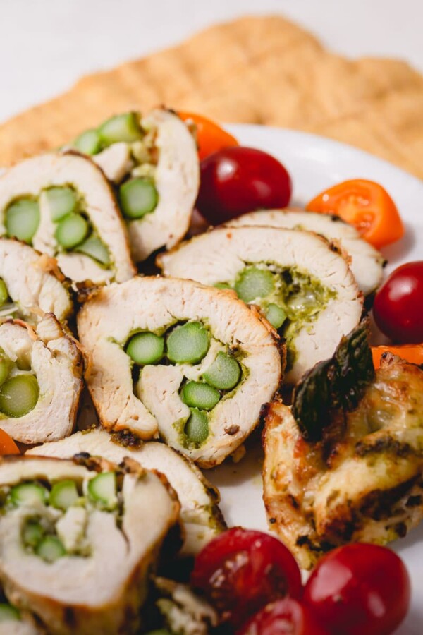 Stuffed chicken roll-ups with asparagus and cheese and smeared with fragrant pesto - an effortlessly impressive and satisfying main dish, or even an appetizer!
