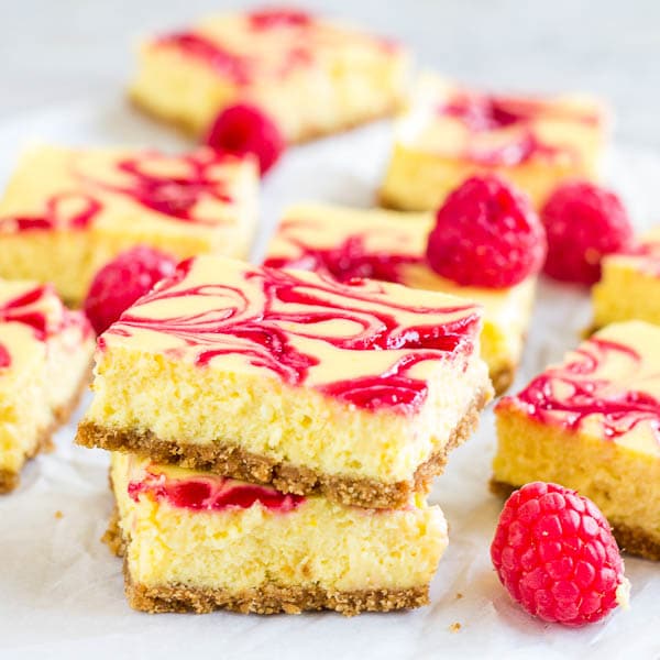 Perfect way to use lemon curd... Irresistibly creamy and soft, this raspberry lemon cheesecake bars are out of this world delicious!