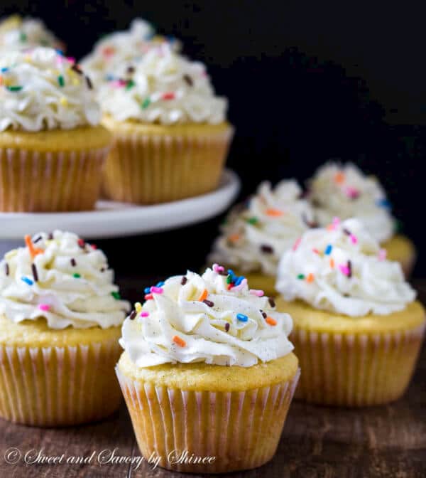 These are deliciously light and soft vanilla bean cupcakes, topped with sky-high silky smooth Swiss meringue buttercream and rainbow of sprinkles, of course!