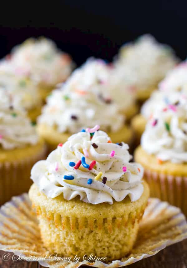 These are deliciously light and soft vanilla bean cupcakes, topped with sky-high silky smooth Swiss meringue buttercream and rainbow of sprinkles, of course!