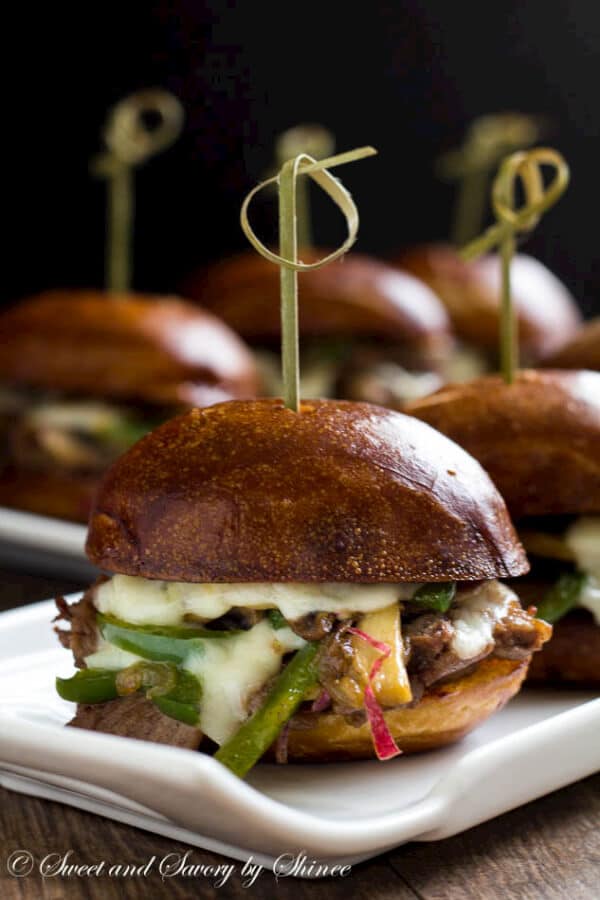 Messy little Philly cheese steak sliders are irresistibly cheesy and flavorful, perfect for your game day menu! 