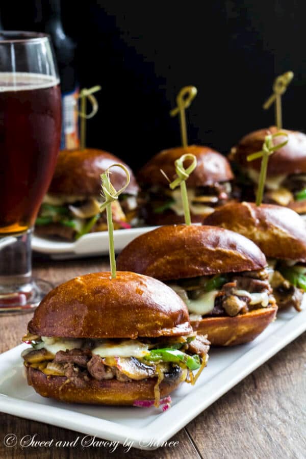 Messy little Philly cheese steak sliders are irresistibly cheesy and flavorful, perfect for your game day menu! 