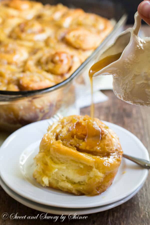 This homemade cinnamon rolls recipe is a keeper! Packed with juicy apples and smothered with apple caramel sauce, these cinnamon rolls are simply the BEST!