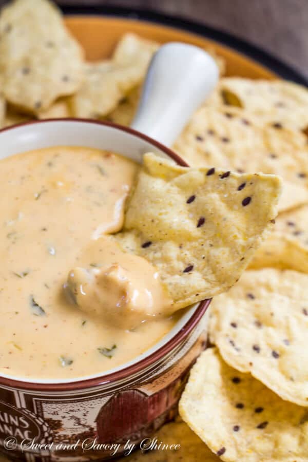 Lusciously creamy and smooth, this hot cheese dip recipe is the easiest thing you'll make for your game day party! Irresistibly cheesy and velvety smooth queso dip, just the way you like it.