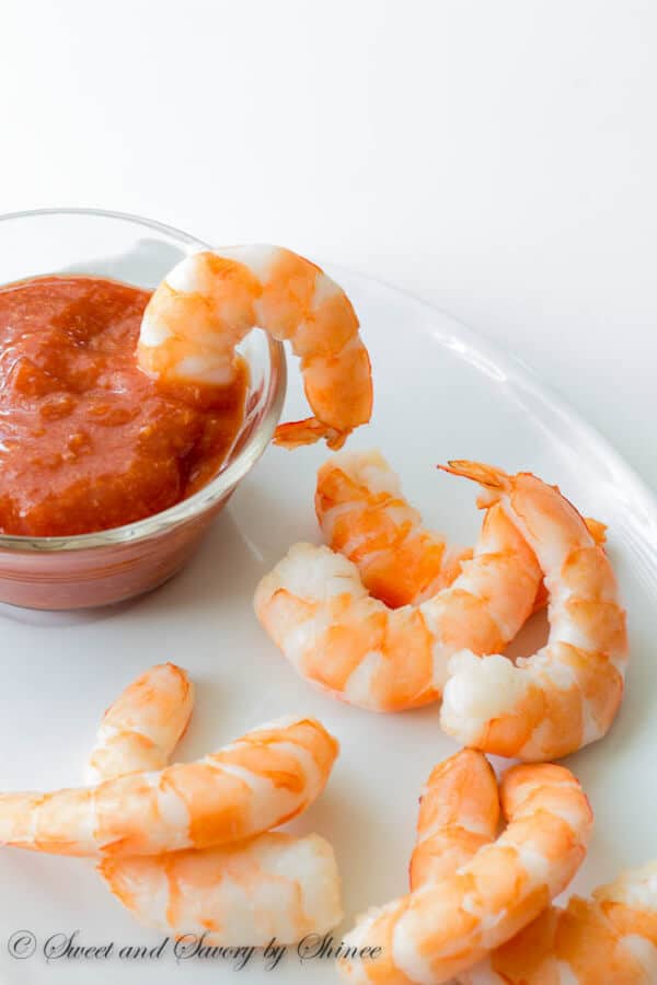 My tips and tricks on poaching the shrimp for classic shrimp cocktail made completely from scratch. Almost as easy as buying a ready tray, but much more flavorful, juicy and delicious! 