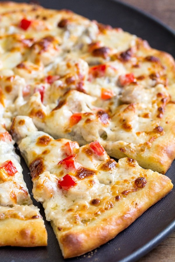 Tips and tricks for delicious thin crust pizza with creamy cheesy chicken alfredo topping.