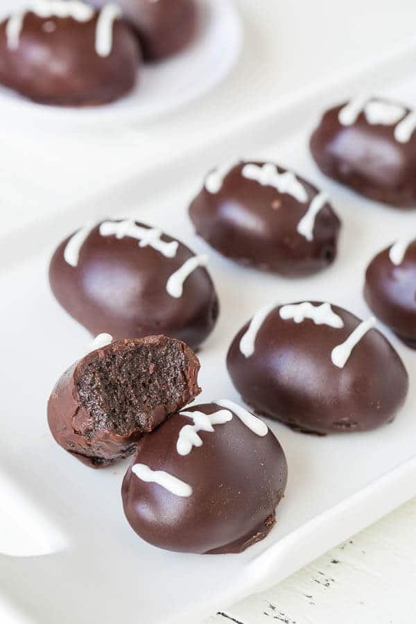 Bring the game spirit to your dessert table with these triple chocolate OREO cookie balls, dressed as an American football!