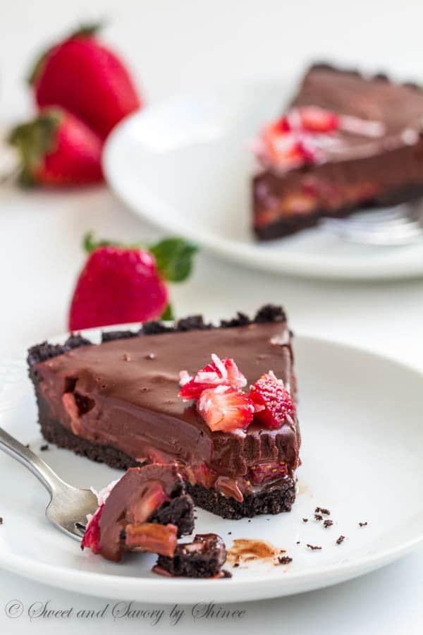 Every bite of this no-bake chocolate truffle tart, filled with fresh strawberries and coconut, literally melts in your mouth! It's chocoholic's dream tart.