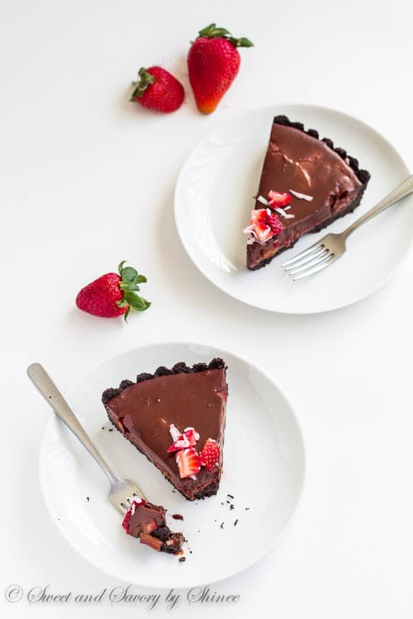 Every bite of this no-bake chocolate truffle tart, filled with fresh strawberries and coconut, literally melts in your mouth! It's chocoholic's dream tart.