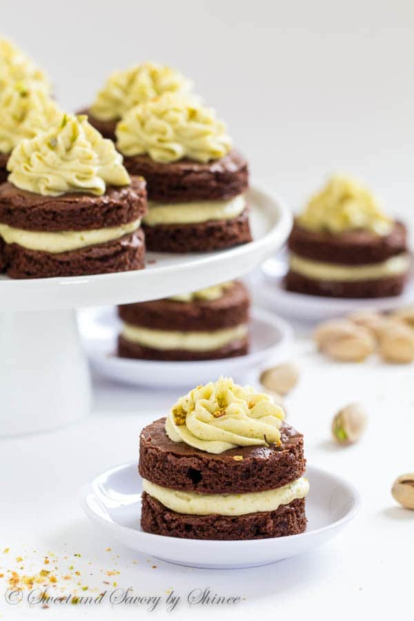 Fudgy, yet light chocolate cake layers, filled with fluffy pistachio buttercream and cut into adorable mini cakes, are irresistible crowd-pleaser.