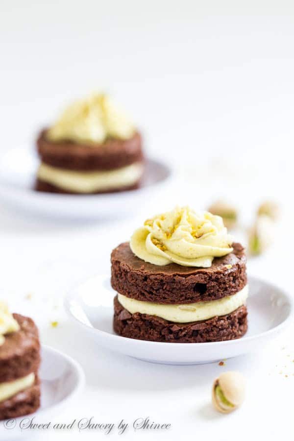 Fudgy, yet light chocolate cake layers, filled with fluffy pistachio buttercream and cut into adorable mini cakes, are irresistible crowd-pleaser.