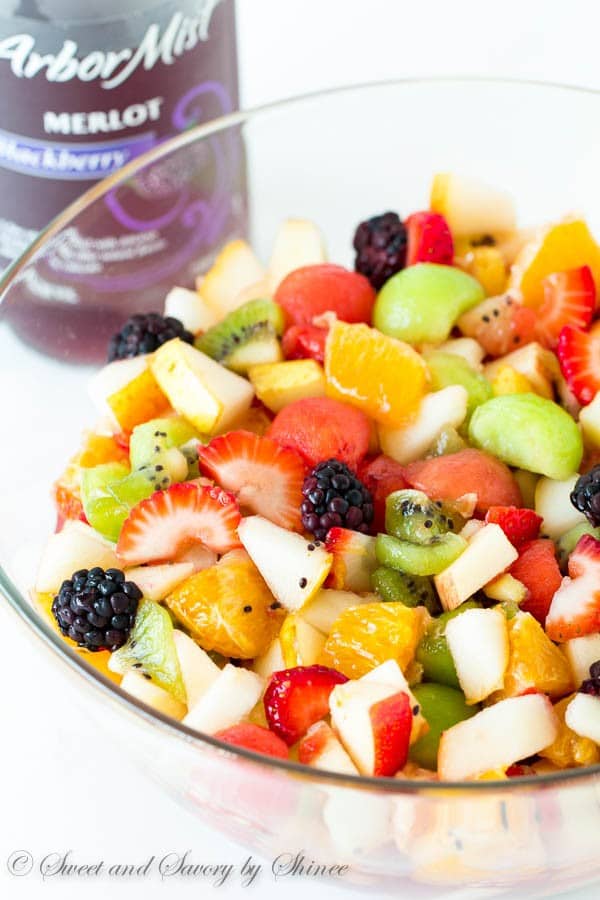 Boozy, fruity and refreshing, this fruit salad is dressed with honey/merlot syrup! Unbelievable flavor combination in one big fruity bowl!