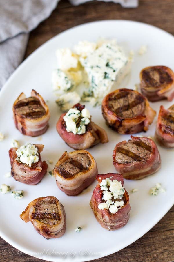 Wrapped in bacon and topped with blue cheese, these melt-in-your-mouth tender mini filet mignons are simply the best!!