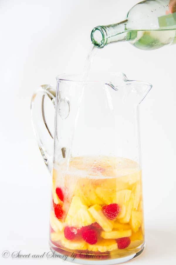 Light and refreshing, this pineapple raspberry sangria is a fun and colorful summer drink for a crowd. Only 5 ingredients required!