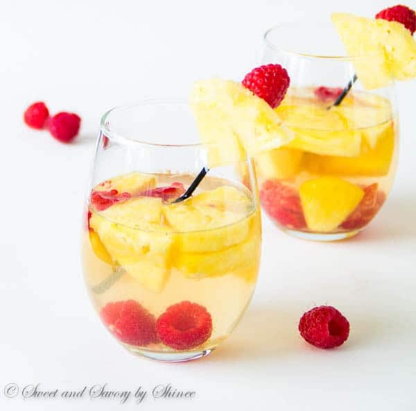 Light and refreshing, this pineapple raspberry sangria is a fun and colorful summer drink for a crowd. Only 5 ingredients required!
