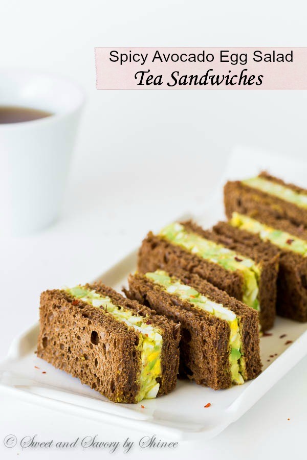 Spicy avocado egg salad sandwiched between chewy pumpernickel bread slices. Perfect texture contrast and flavor combination!