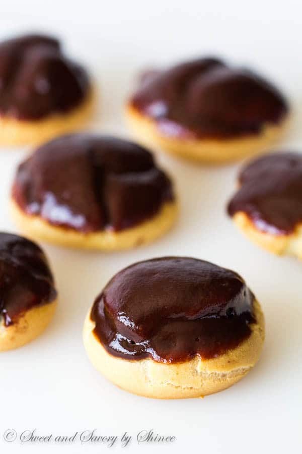 Simple cream puffs filled with light Nutella whipped cream and topped with glossy chocolate ganache. Light and flavorful dessert for all occasions!