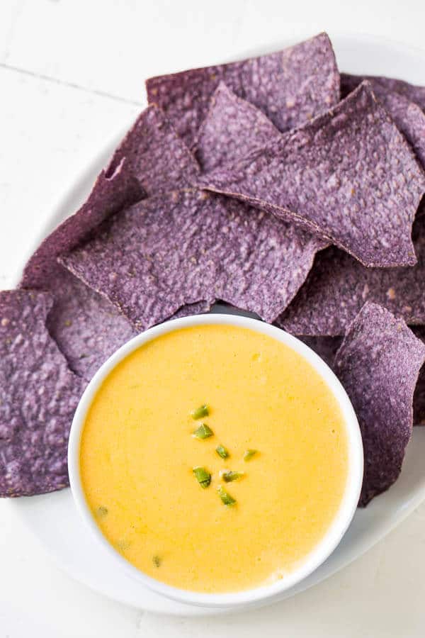 Silky smooth, rich and spicy, this cheddar cheese dip is addicting! Bring out the tortilla chips and dig in.