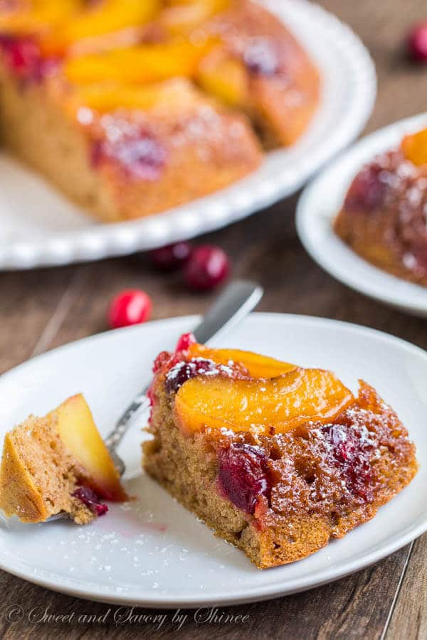 Juicy sweet apples and tart cranberries simmered in caramelized sauce soak into tender spiced coffee cake. This apple cranberry upside down coffee cake is a must this holiday season. 