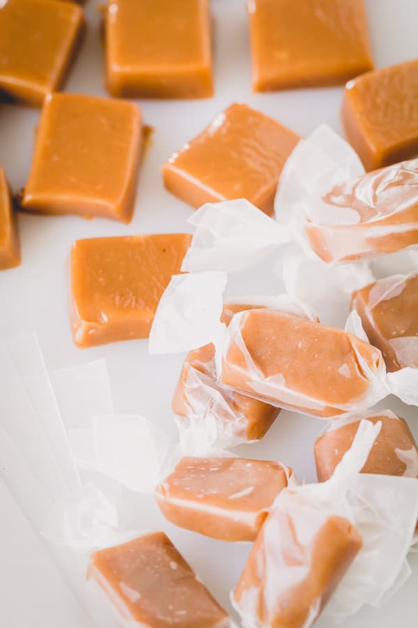 One of my favorite Christmas treats are soft and chewy caramels! It's so easy to make and this cardamom infused candies are seriously addicting! #caramels #homemadecaramels