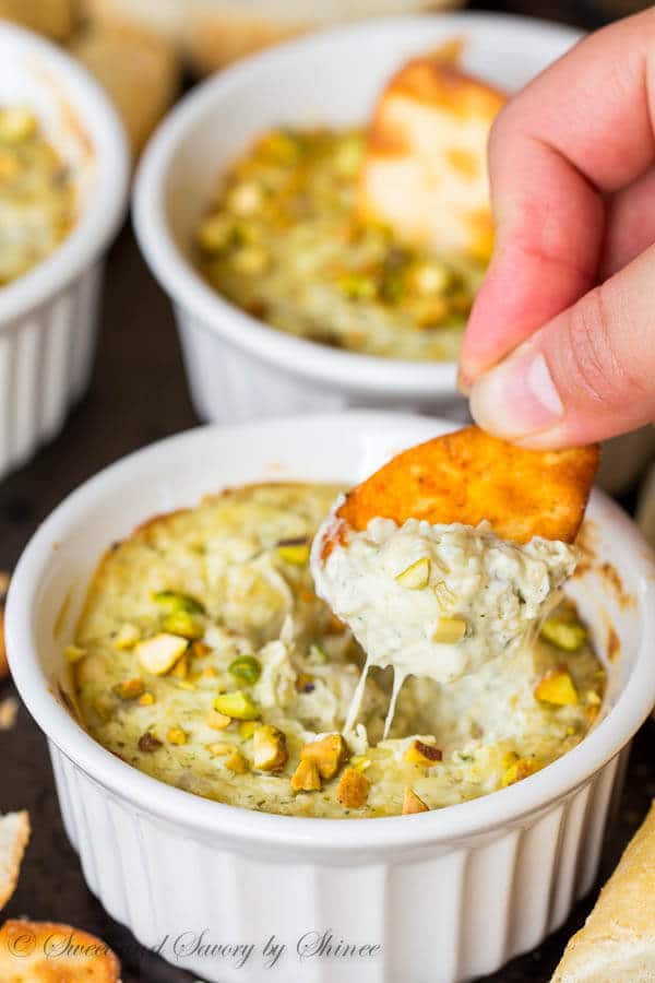 Super simple, super flavorful, and super cute! Your regular artichoke dip took a unique twist with added pesto for an additional, but complimentary flavor pop!