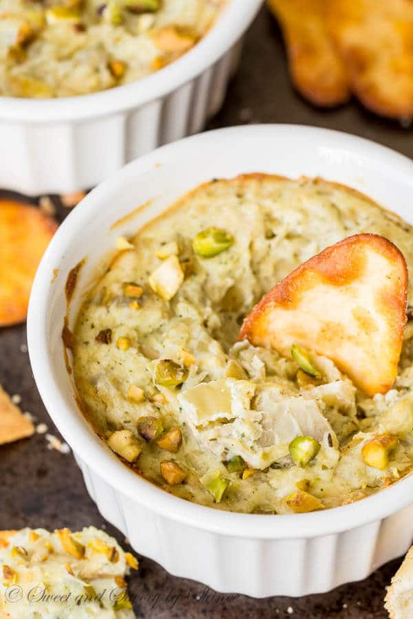Super simple, super flavorful, and super cute! Your regular artichoke dip took a unique twist with added pesto for an additional, but complimentary flavor pop!