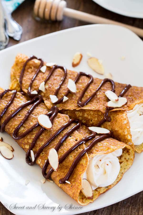 Irresistibly delicate, nutty and sweet, these honey almond crepes make me weak at the knees every single time I make them. And that tangy honey whipped cream is an icing on the cake!
