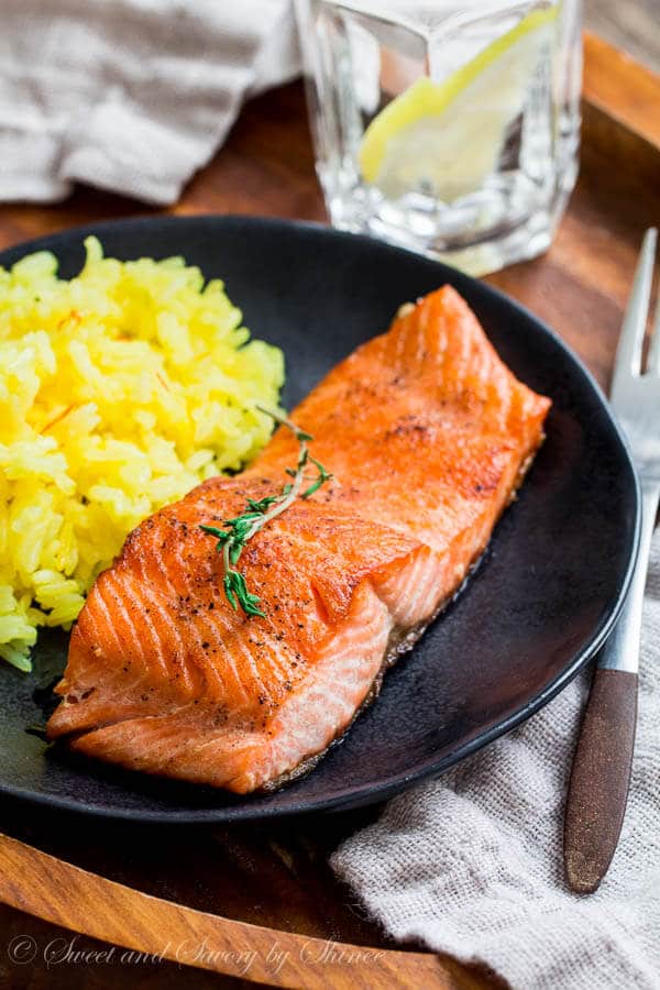 Beautiful pan fried steelhead trout with crispy skin and juicy tender meat, smothered with tangy thyme lemon butter sauce. Delicious dinner in minutes!
