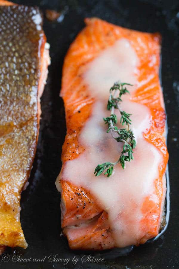 Beautiful pan fried steelhead trout with crispy skin and juicy tender meat, smothered with tangy thyme lemon butter sauce. Delicious dinner in minutes!