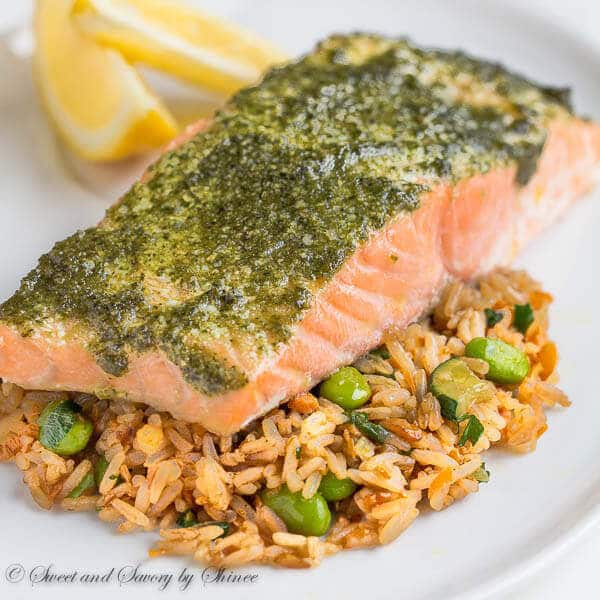 Fool-proof method for delicately tender and juicy baked salmon every time! You'll love melt-in-your-mouth buttery salmon layers infused with flavorful pesto sauce!