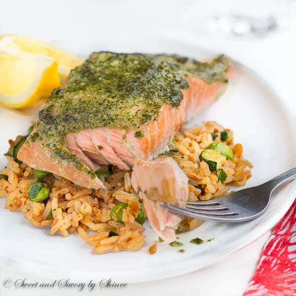 Fool-proof method for delicately tender and juicy baked salmon every time! You'll love melt-in-your-mouth buttery salmon layers infused with flavorful pesto sauce!