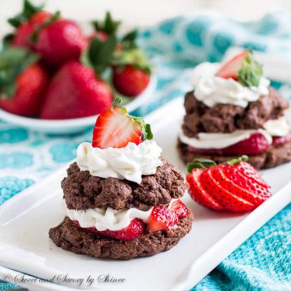 Irresistibly decadent twist on classic strawberry shortcakes! Try these tender and rich chocolate shortcakes filled with juicy strawberries and whipped cream.