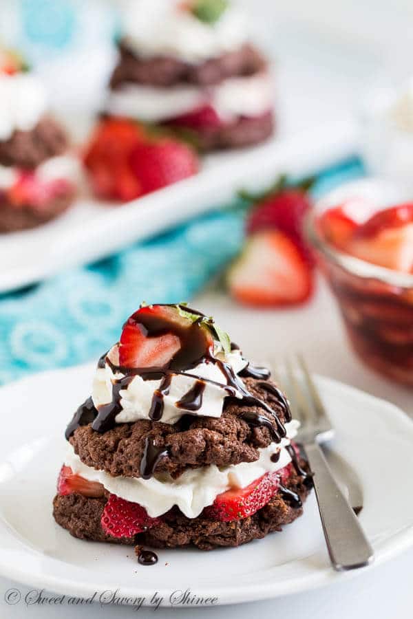 Irresistibly decadent twist on classic strawberry shortcakes! Try these tender and rich chocolate shortcakes filled with juicy strawberries and whipped cream. Additional drizzle of chocolate sauce is completely optional, but I know you wouldn't skip it.