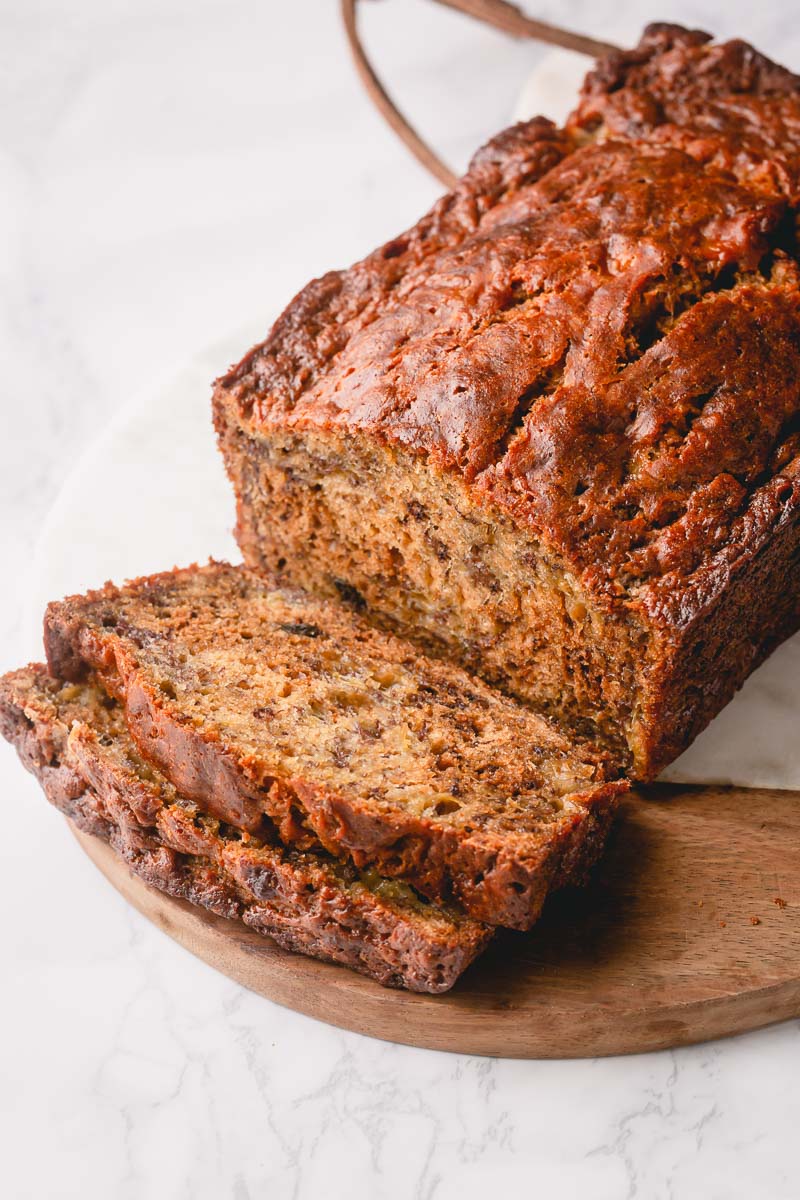 My go-to banana bread recipe since 2013, and it's the BEST!! This recipe makes two moistest and most flavorful banana breads with simple ingredients and just a wooden spoon! The only banana bread recipe you'll ever need!! #bananabread