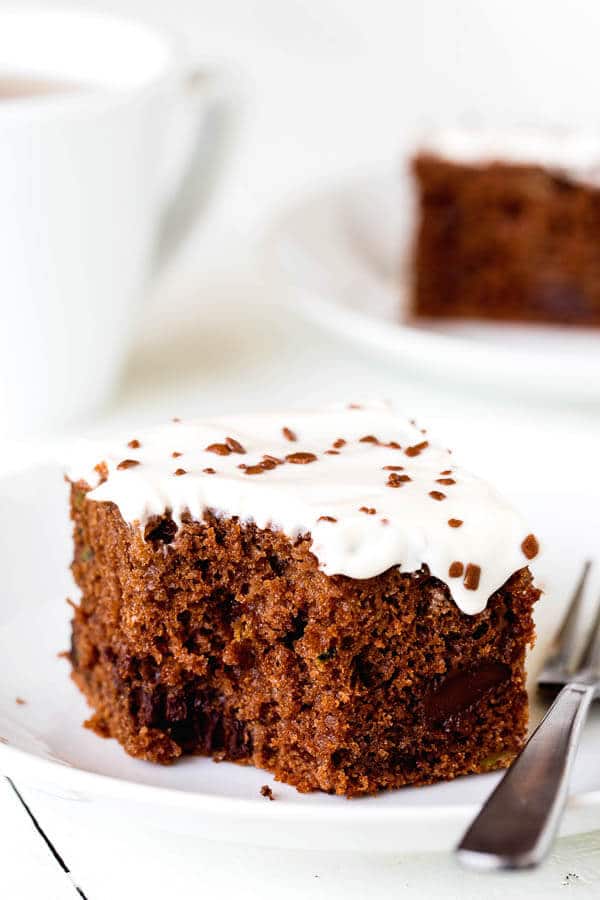 This double chocolate zucchini sheet cake is an effortless way to feed a crowd! No mixer required. Plus, your guests won't even know there's zucchini in the cake!