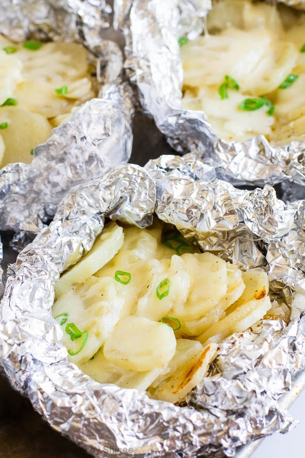 You're gonna love these individual potato packets loaded with roasted garlic and ooey gooey cheese. Because these are convenient, easy and absolutely tasty! One secret ingredient takes these potatoes from good to great.