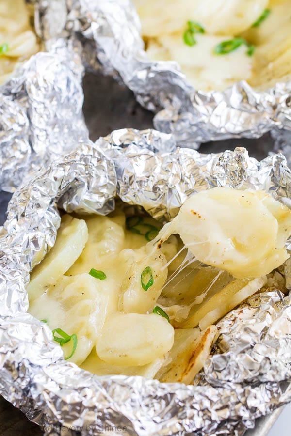 You're gonna love these individual potato packets loaded with roasted garlic and ooey gooey cheese. Because these are convenient, easy and absolutely tasty! One secret ingredient takes these potatoes from good to great.