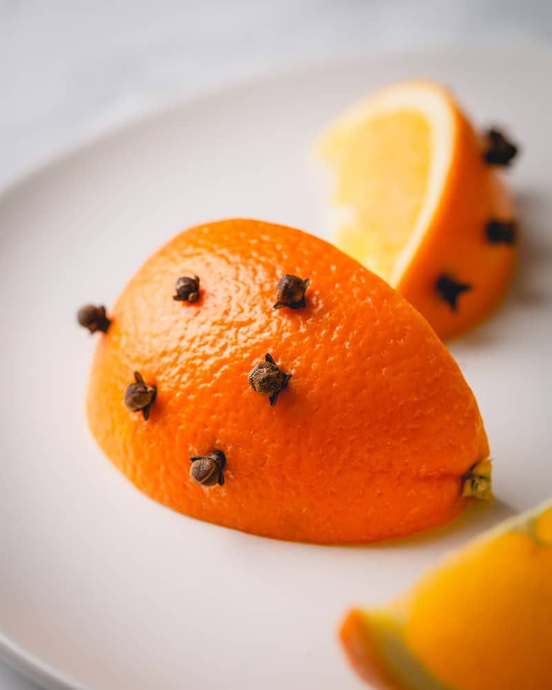 A wedge of orange, studded with whole cloves.