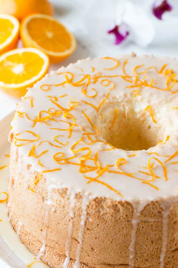 Infused with citrusy floral orange blossom, this angel food cake is simply the BEST! And you sure don't want to omit that orange curd, it takes this cake from great to FABULOUS!