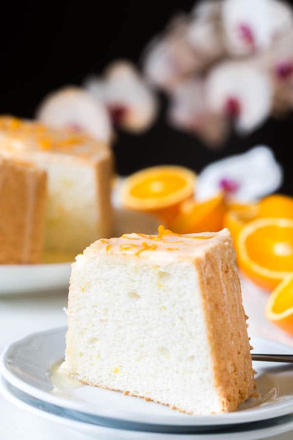 Angel food cake from your dreams. Light and fluffy sponge cake, infused with citrusy floral orange blossom and topped with sweet orange curd. Out of this world!
