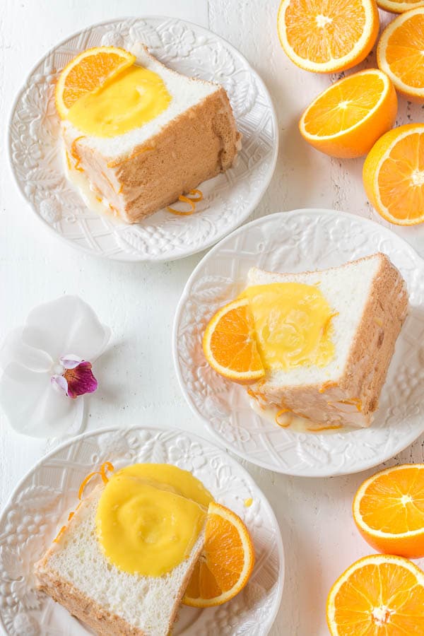 Infused with citrusy floral orange blossom, this angel food cake is simply the BEST! And you sure don't want to omit that orange curd, it takes this cake from great to FABULOUS!