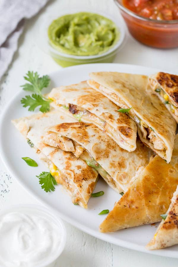 This 30-minute cheesy chicken quesadillas recipe is super quick and easy weeknight dinner made delicious!