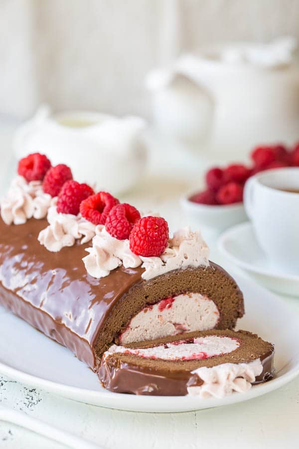 Incredibly light and moist chocolate roll cake with raspberry mousse filling. I can't pick which part is better, but I know together they make one irresistible dessert!