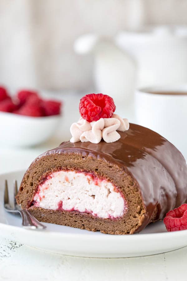Incredibly light and moist chocolate roll cake with raspberry mousse filling. I can't pick which part is better, but I know together they make one irresistible dessert!