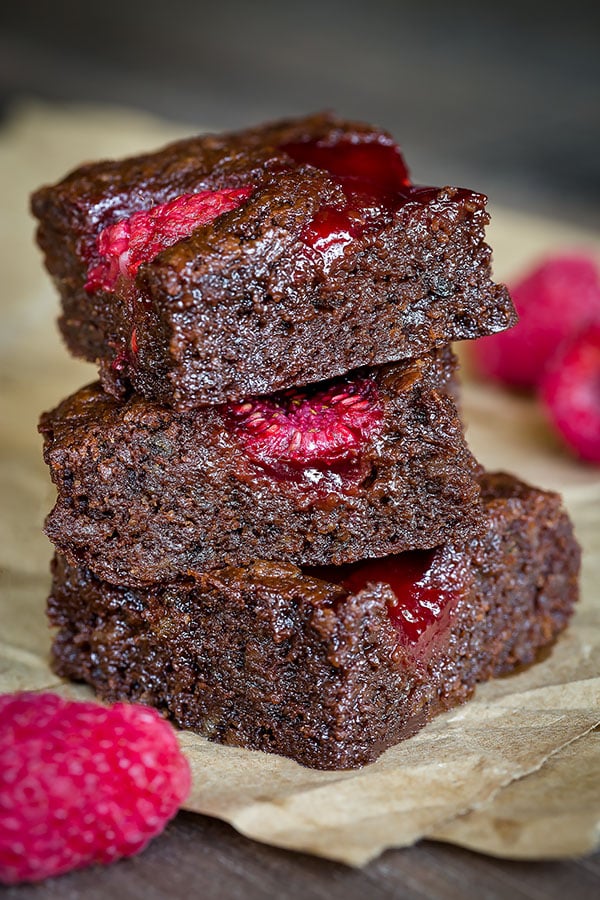Bursting with juicy sweet raspberries in every bite, this rich and fudgy raspberry brownies are da BOMB! So good it's dangerous! And everything comes together in ONE bowl. #brownies #chocolatedessert #dessert #raspberrybrownies #baking