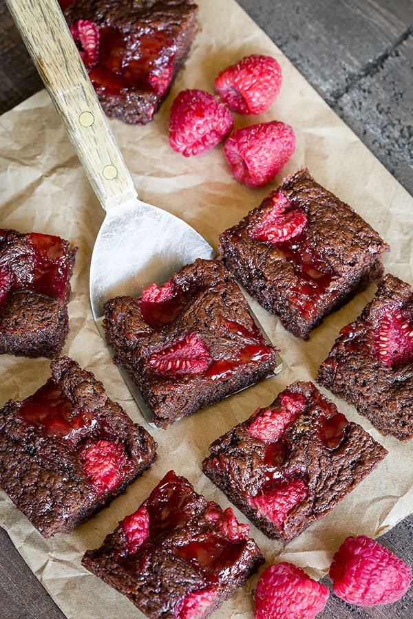 Bursting with juicy sweet raspberries in every bite, this rich and fudgy raspberry brownies are da BOMB! So good it's dangerous! And everything comes together in ONE bowl. #brownies #chocolatedessert #dessert #raspberrybrownies #baking